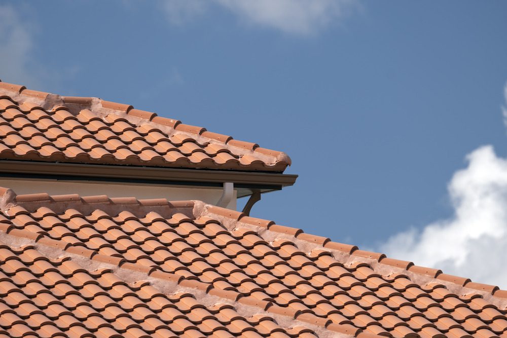 Overlapping ceramic tiles on roof.