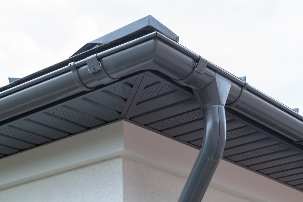 New gutter system installed on roof of home.